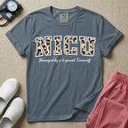 Neonatal Intensive Care Unit NICU nurse t-shirt with leopard print block letters and funny managed by a 4-pound terrorist graphic in blue jean color.