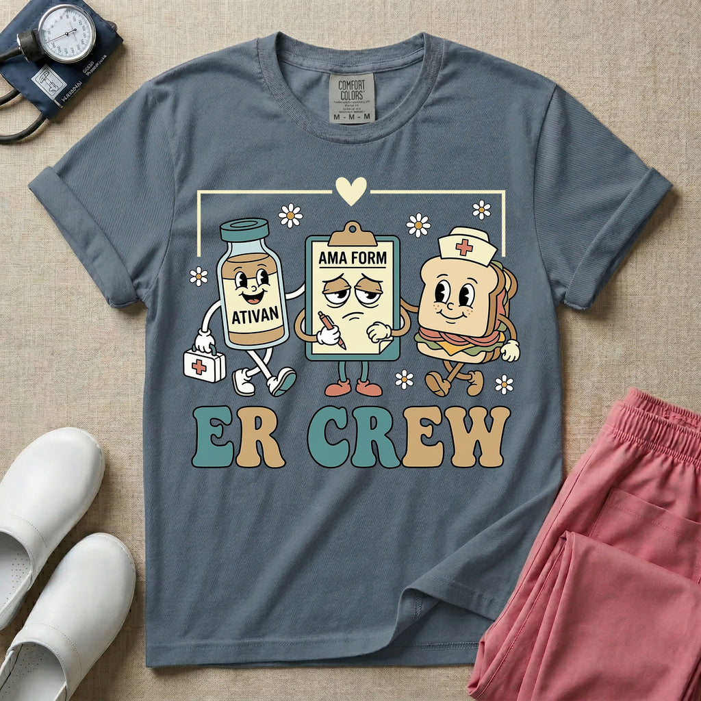 A retro-style t-shirt for emergency room nurses featuring the text "ER CREW" below a vintage cartoon illustration of a medicine bottle, a grumpy clipboard holding an AMA form, and a sandwich wearing a nurse cap walking together.