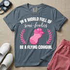 A humorous graphic tee for labor and delivery nurses featuring an illustration of a peanut ball wearing a cowboy hat, framed by laurel branches, along with the text "IN A WORLD FULL OF semi-fowlers BE A FLYING COWGIRL".