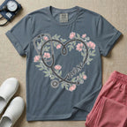 General nursing t-shirt featuring a heart-shaped stethoscope design intertwined with pink flowers and the cursive text "nurse".