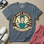 General nursing night shift nurse t-shirt with a retro vintage exhausted nurse holding coffee and a syringe established by caffeine and chaos graphic in blue jean color.