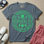 A circular green graphic featuring a leprechaun hat, shamrocks, and the text ST. PATRICK'S DAY SHENANIGANS SQUAD surrounding a center banner that reads NEONATAL ICU.
