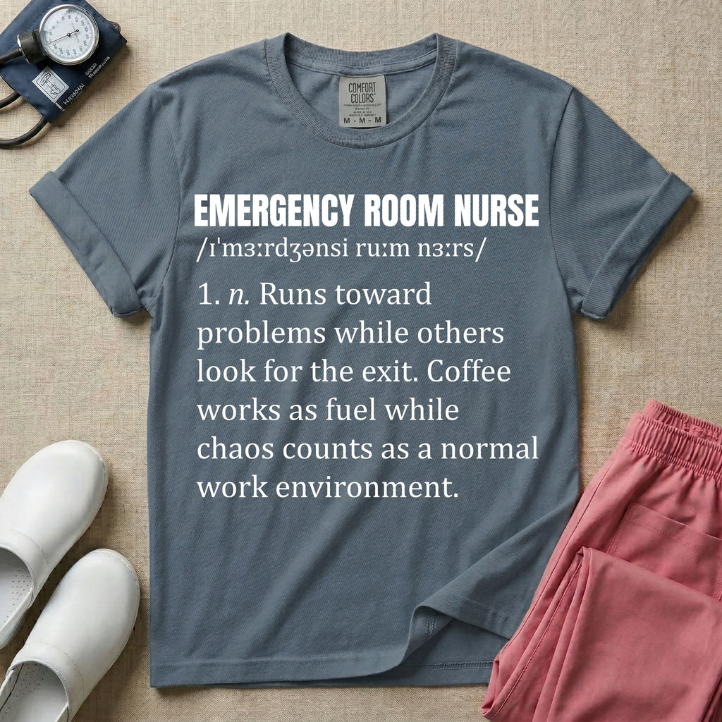 A minimalist t-shirt for emergency room nurses featuring a dictionary definition graphic for the term "EMERGENCY ROOM NURSE" with a phonetic pronunciation and a humorous description about running toward problems, using coffee as fuel, and thriving in chaos.