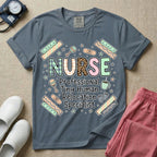 A humorous graphic for labor and delivery, postpartum, and neonatal nurses featuring the word 'NURSE' in large, mismatched patterned letters including leopard print and florals, stacked above the phrase 'Professional Tiny Human Relocation Specialist', and surrounded by cute doodles of decorated bandaids, baby footprints, a rattle, and a coffee mug.