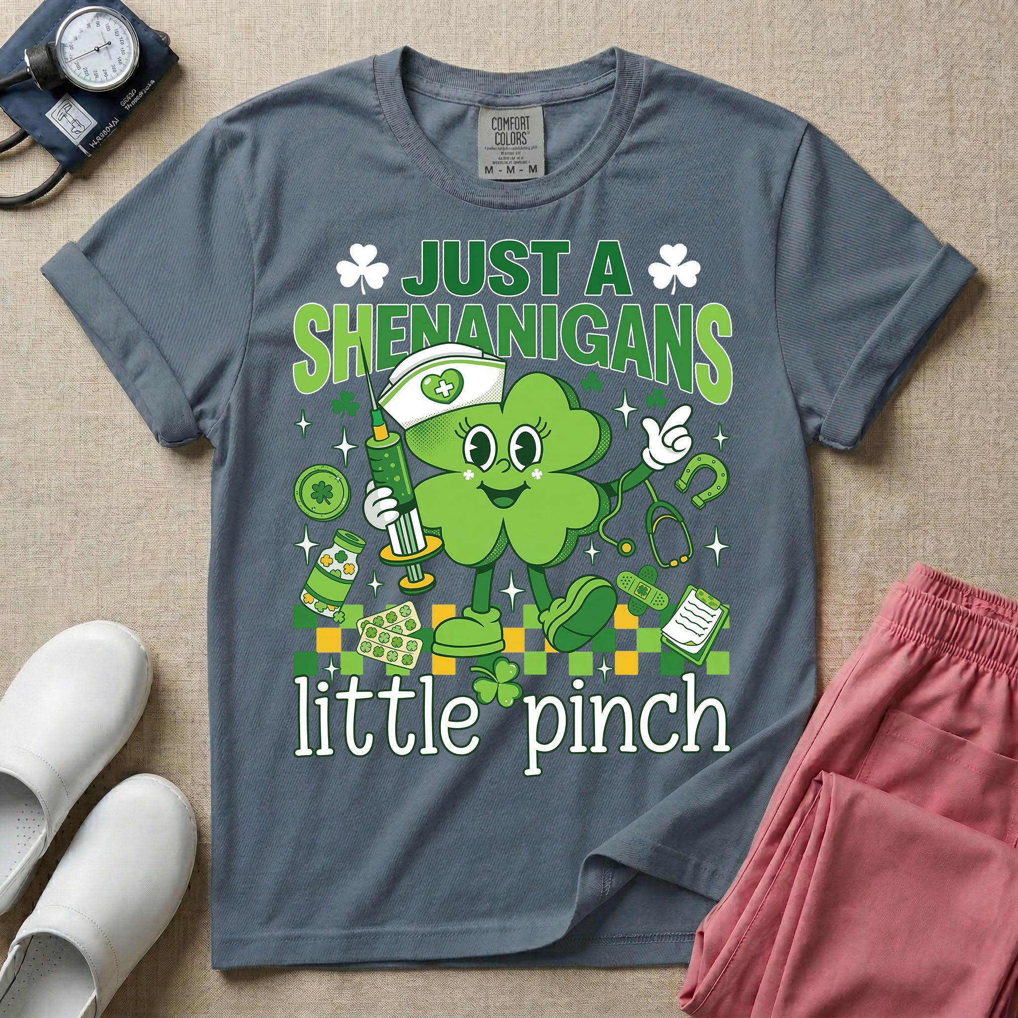 General nursing nurse t-shirt with a retro clover just a shenanigans little pinch graphic in blue jean color.