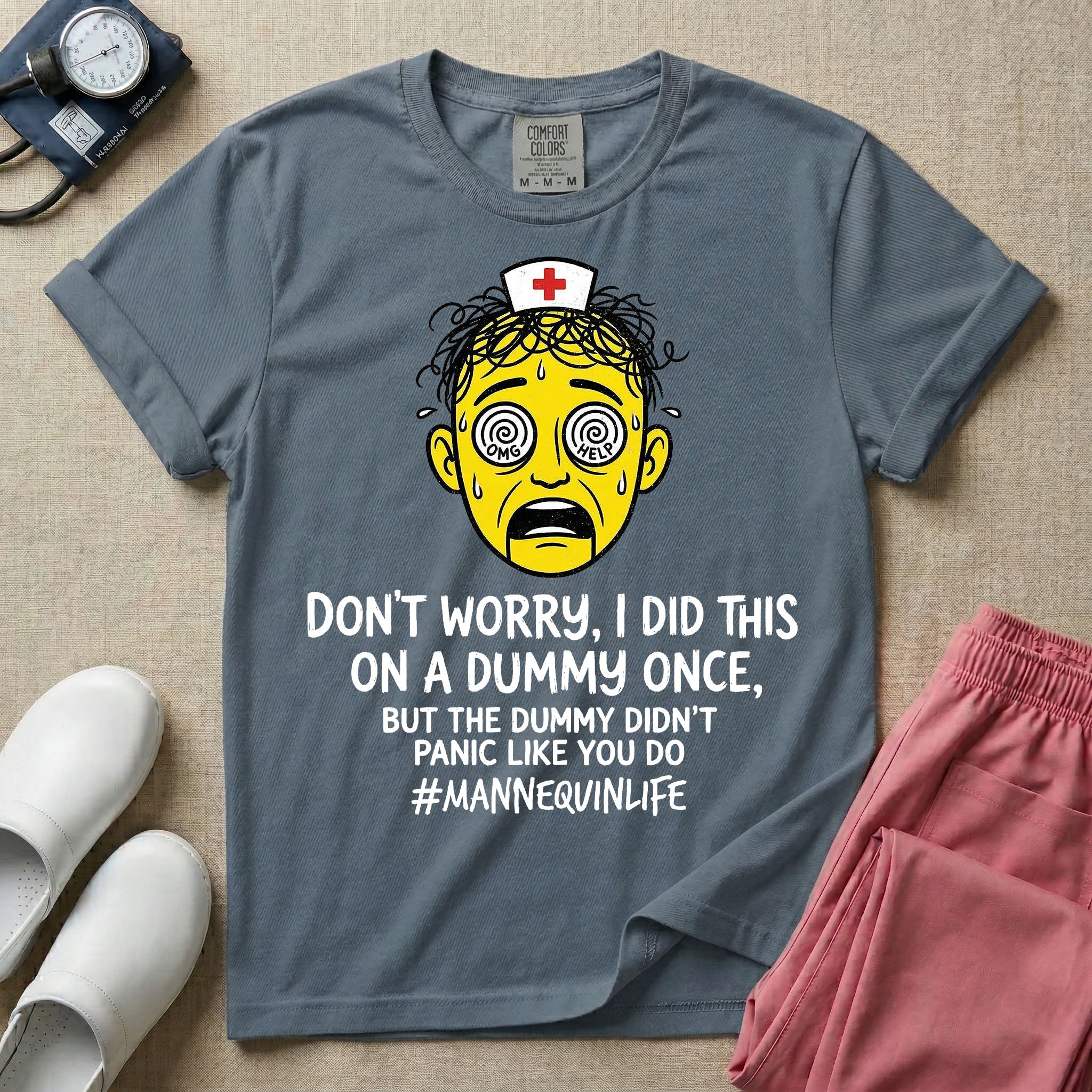 General nursing nurse t-shirt with a funny don't worry I did this on a mannequin once but the dummy didn't panic like you do graphic in blue jean color.