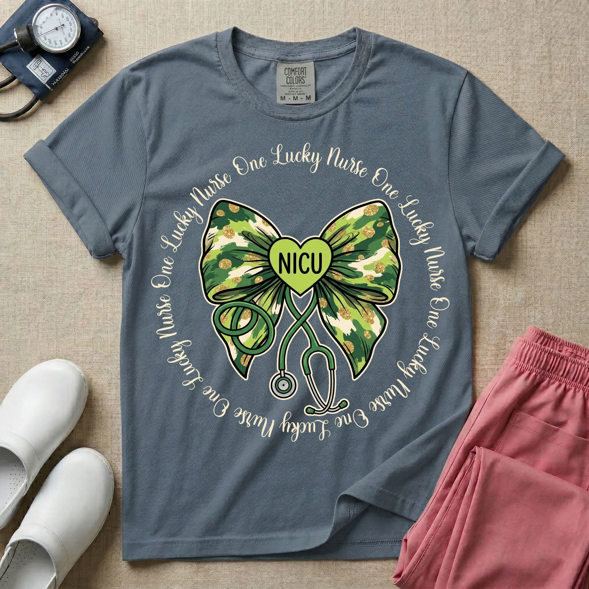 A graphic for a Neonatal Intensive Care Unit featuring a green camouflage bow with a stethoscope dangling from the bottom, a green heart in the center reading 'NICU', and the phrase 'One Lucky Nurse' repeating in a circle around the design.