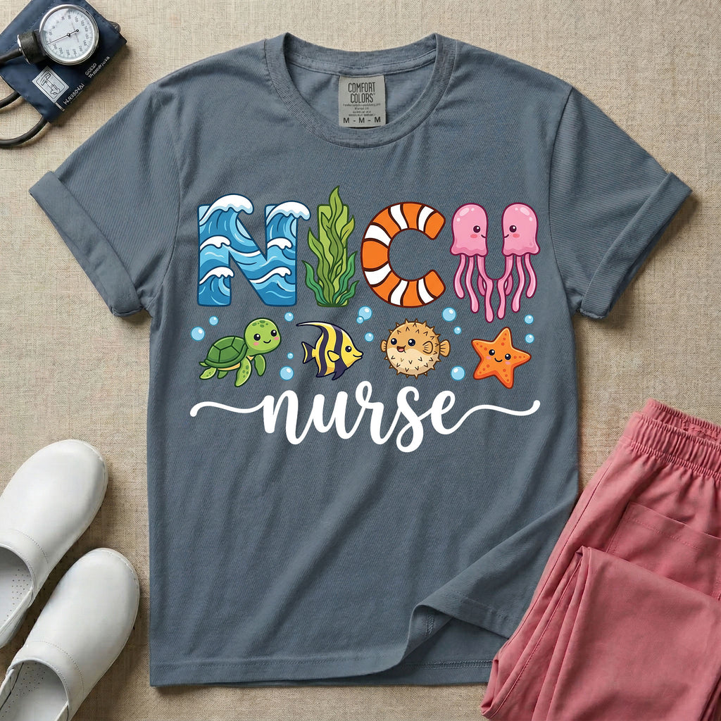 A cute t-shirt for NICU nurses featuring the text "NICU nurse" where the letters are designed with ocean elements like waves, seaweed, and a jellyfish, surrounded by under the sea creatures including a sea turtle, tropical fish, pufferfish, and starfish.