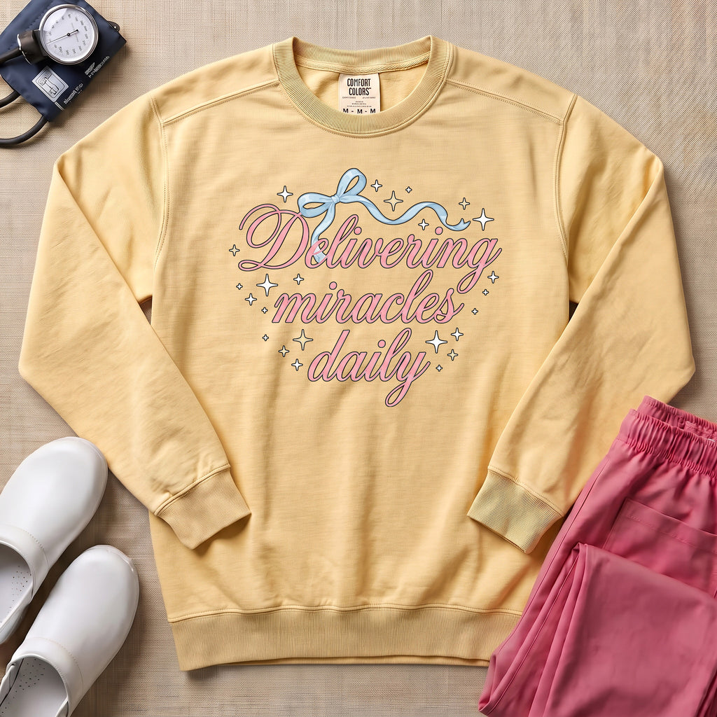 Delivering Miracles Daily L&D and NICU Nurse Sweatshirt - Butter Comfort Colors Sweatshirt | HugTee