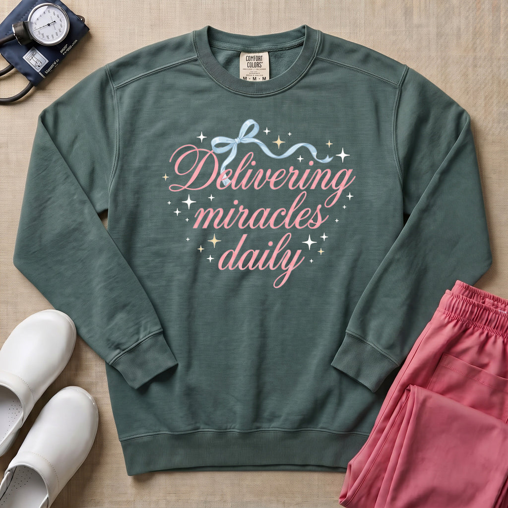 Delivering Miracles Daily L&D and NICU Nurse Sweatshirt - Blue Spruce Comfort Colors Sweatshirt | HugTee