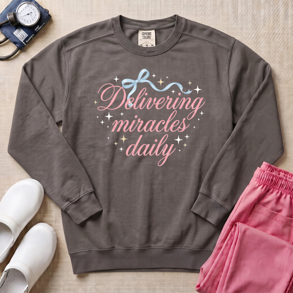 Delivering Miracles Daily L&D and NICU Nurse Sweatshirt - Pepper Lifestyle Hero Mockup | HugTee