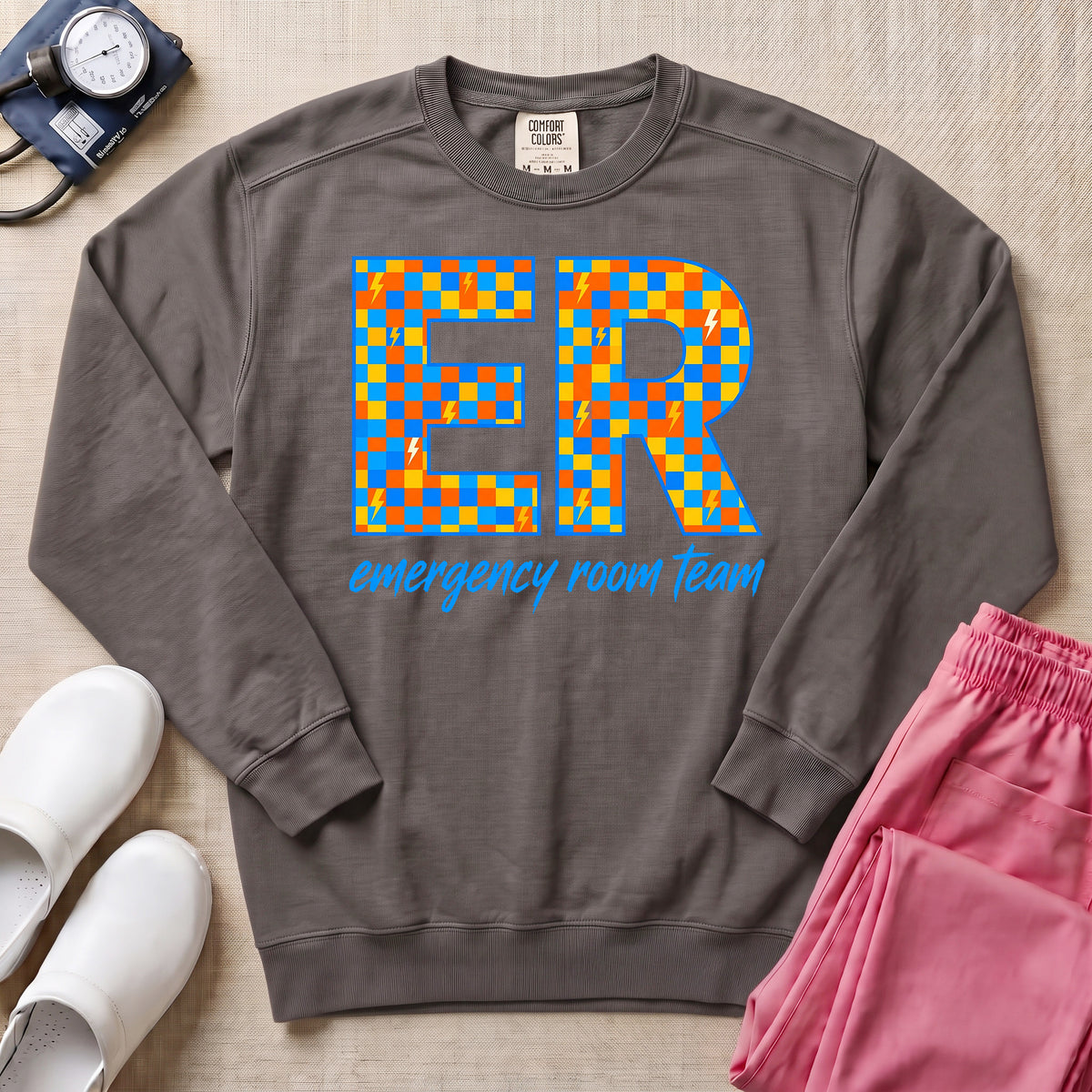 Retro Checkerboard ER Nurse Emergency Room Team Sweatshirt - Pepper Lifestyle Hero Mockup | HugTee