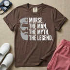 General nursing t-shirt featuring a minimalist white graphic of a bearded man wearing sunglasses and a nurse cap alongside the text "MURSE. THE MAN. THE MYTH. THE LEGEND."