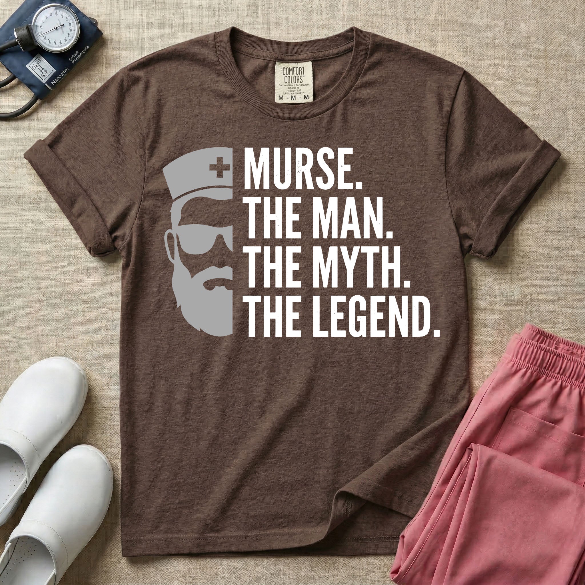 General nursing t-shirt featuring a minimalist white graphic of a bearded man wearing sunglasses and a nurse cap alongside the text "MURSE. THE MAN. THE MYTH. THE LEGEND."