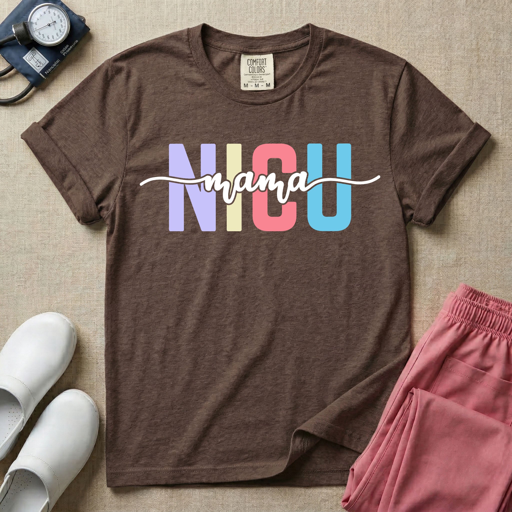 A graphic for the Neonatal Intensive Care Unit featuring the word 'NICU' in large, colorful pastel block letters with the word 'mama' written in a flowing white cursive font across the center.