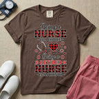 A t-shirt featuring the text Being a NURSE IS A CHOICE Being a RETIRED NURSE IS AN HONOR surrounding a central graphic of a red and black buffalo plaid heart intertwined with a stethoscope.