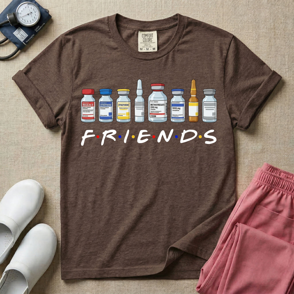 A humorous retro-style t-shirt for nurses featuring a row of seven different medical vials and medicine ampules lined up above the word "FRIENDS", which is styled with colored dots between the letters to resemble the classic television show logo.