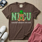 A graphic for a Neonatal Intensive Care Unit featuring the word 'NICU' in green and white plaid patterned letters, with a cute brown teddy bear wearing a leprechaun hat and holding a shamrock sitting in the middle, and the cursive text 'neonatal intensive care unit' underneath.