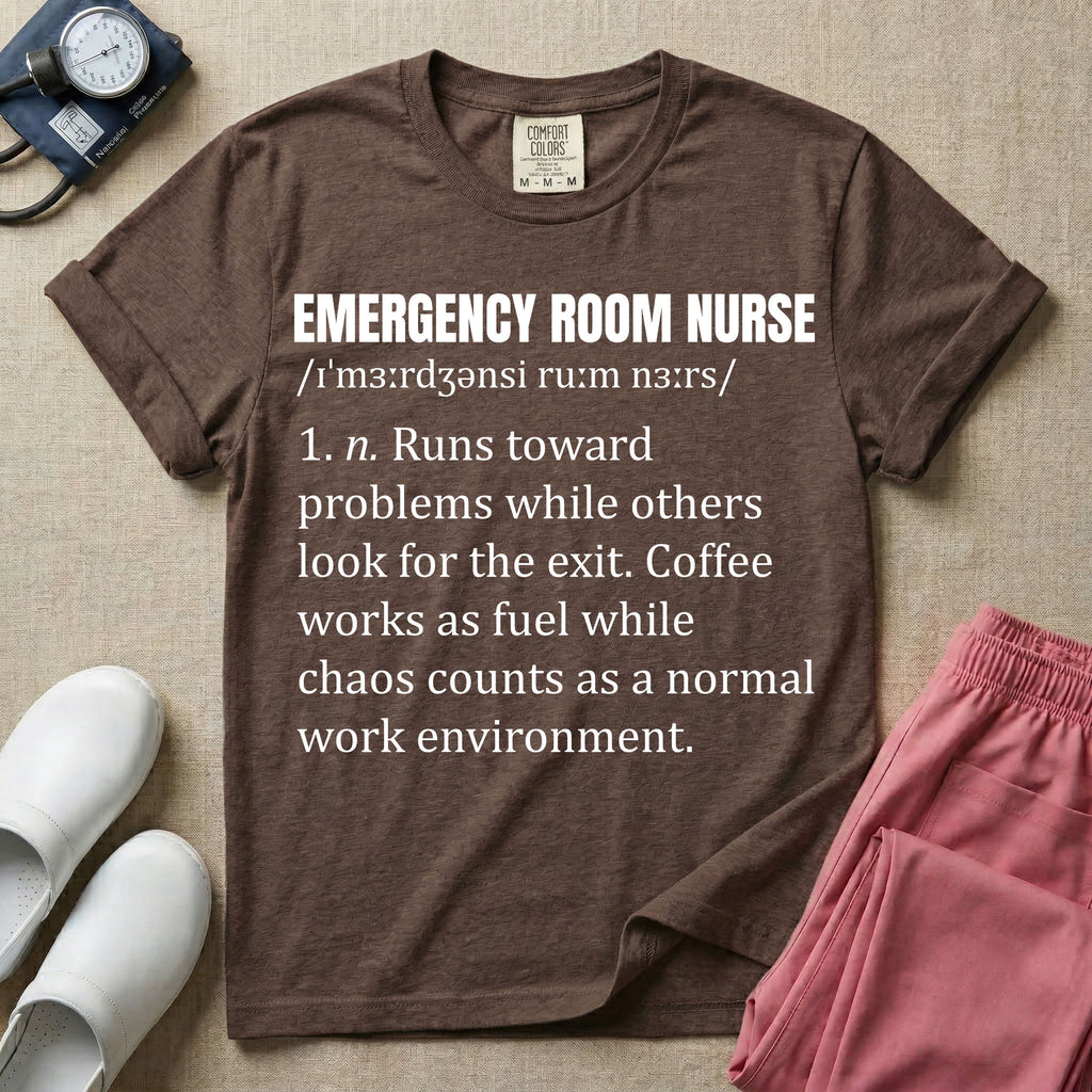 A minimalist t-shirt for emergency room nurses featuring a dictionary definition graphic for the term "EMERGENCY ROOM NURSE" with a phonetic pronunciation and a humorous description about running toward problems, using coffee as fuel, and thriving in chaos.