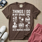 A t-shirt featuring the text THINGS I DO IN MY SPARE TIME AS A NURSING STUDENT surrounded by humorous line-art icons depicting studying, drinking coffee, and lacking sleep.