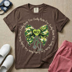 A graphic for a Neonatal Intensive Care Unit featuring a green camouflage bow with a stethoscope dangling from the bottom, a green heart in the center reading 'NICU', and the phrase 'One Lucky Nurse' repeating in a circle around the design.