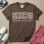 Neonatal Intensive Care Unit NICU nurse t-shirt with leopard print block letters and funny managed by a 4-pound terrorist graphic in espresso color.