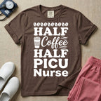 A funny pediatric intensive care nursing t-shirt featuring the stacked white text "HALF COFFEE HALF PICU Nurse" accented with simple graphics of coffee beans and a to-go coffee cup.
