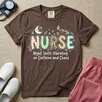 A humorous General Nursing graphic featuring the word NURSE in large, playfully patterned letters including plaid, leopard print, and floral designs, accented by a sleeping crescent moon and a syringe, positioned above text that reads Night Shift: Vibrating on Caffeine and Chaos.