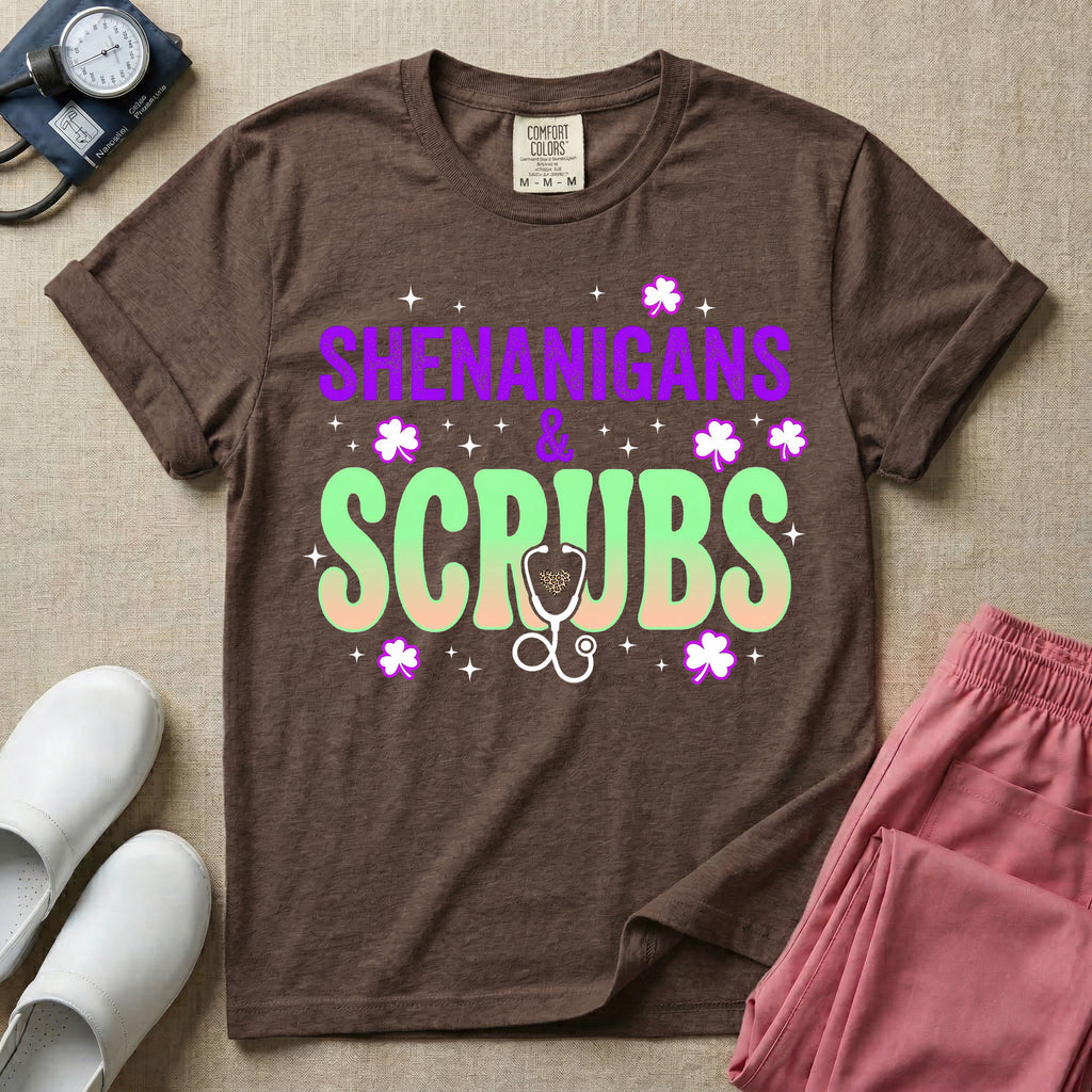 General nursing St. Patrick's Day t-shirt featuring a retro wavy font with the text "SHENANIGANS & SCRUBS" surrounded by shamrock graphics and a stethoscope.