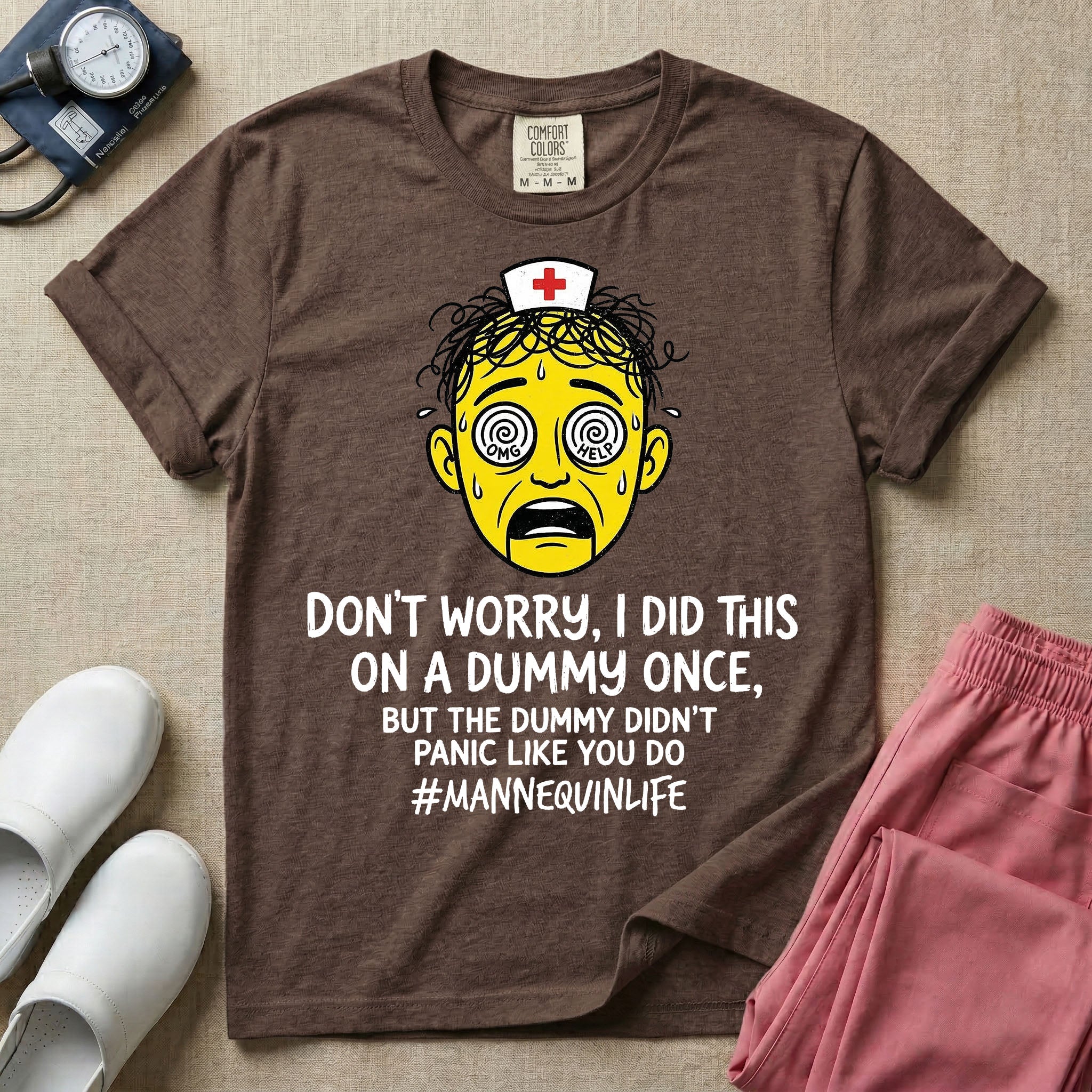 General nursing nurse t-shirt with a funny don't worry I did this on a mannequin once but the dummy didn't panic like you do graphic in espresso color.
