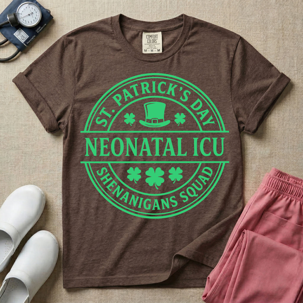 A circular green graphic featuring a leprechaun hat, shamrocks, and the text ST. PATRICK'S DAY SHENANIGANS SQUAD surrounding a center banner that reads NEONATAL ICU.