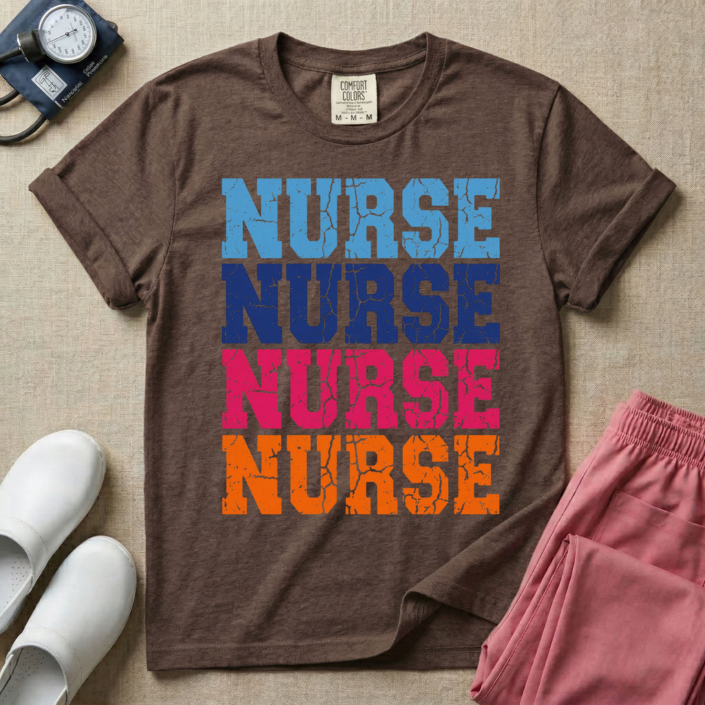 A t-shirt featuring the word NURSE repeated four times in a stacked vertical layout with a distressed, vintage texture in blue, navy, pink, and orange colors.