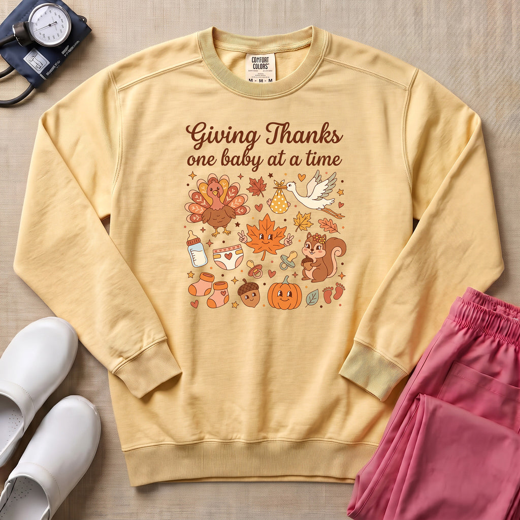 Retro Giving Thanks One Baby At A Time Thanksgiving L&D and NICU Nurse Sweatshirt - Butter Comfort Colors Sweatshirt | HugTee