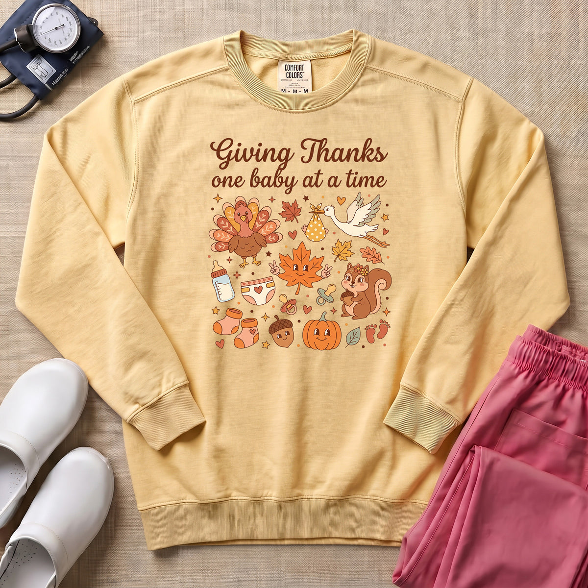Retro Giving Thanks One Baby At A Time Thanksgiving L&D and NICU Nurse Sweatshirt - Butter Comfort Colors Sweatshirt | HugTee
