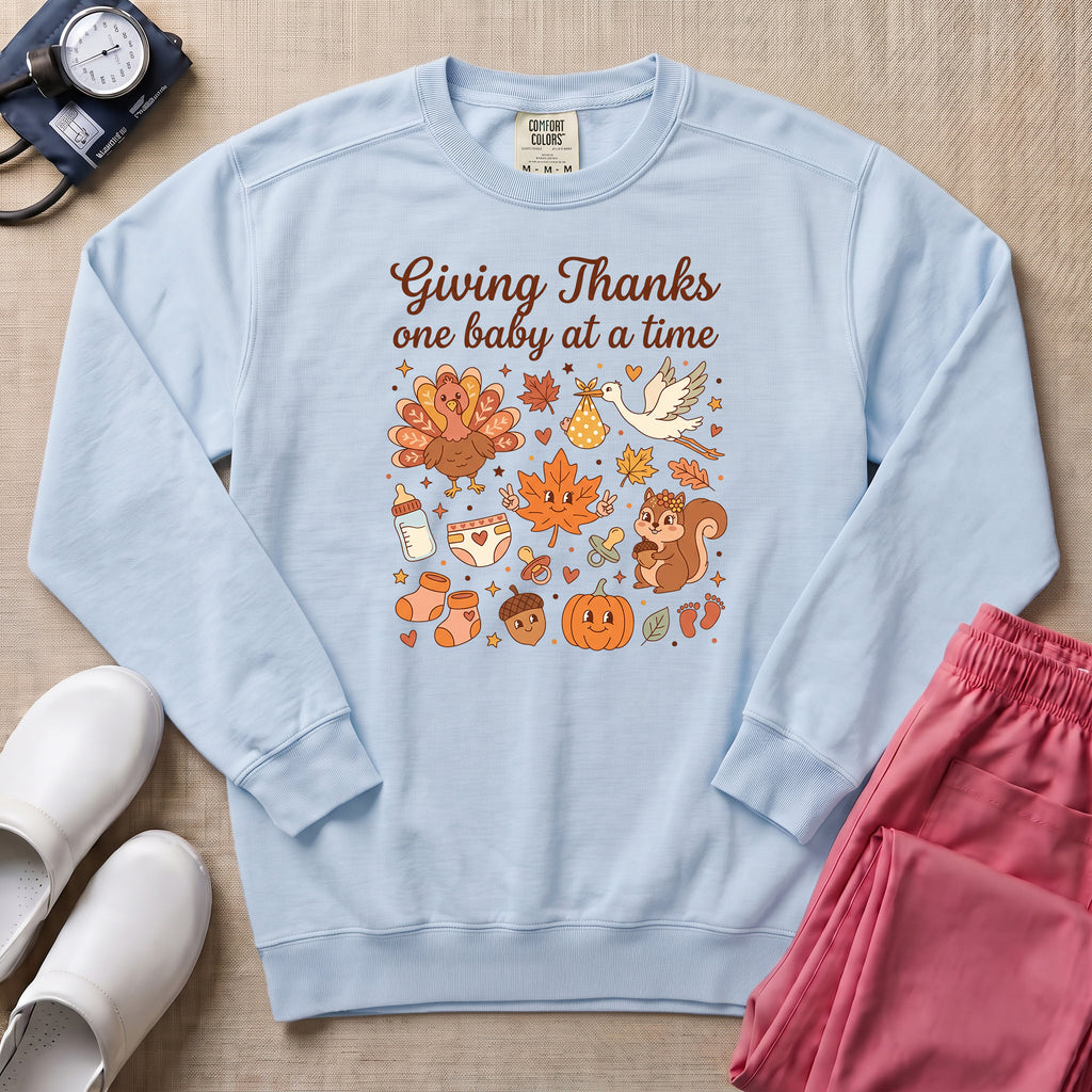 Retro Giving Thanks One Baby At A Time Thanksgiving L&D and NICU Nurse Sweatshirt - Chambray Comfort Colors Sweatshirt | HugTee
