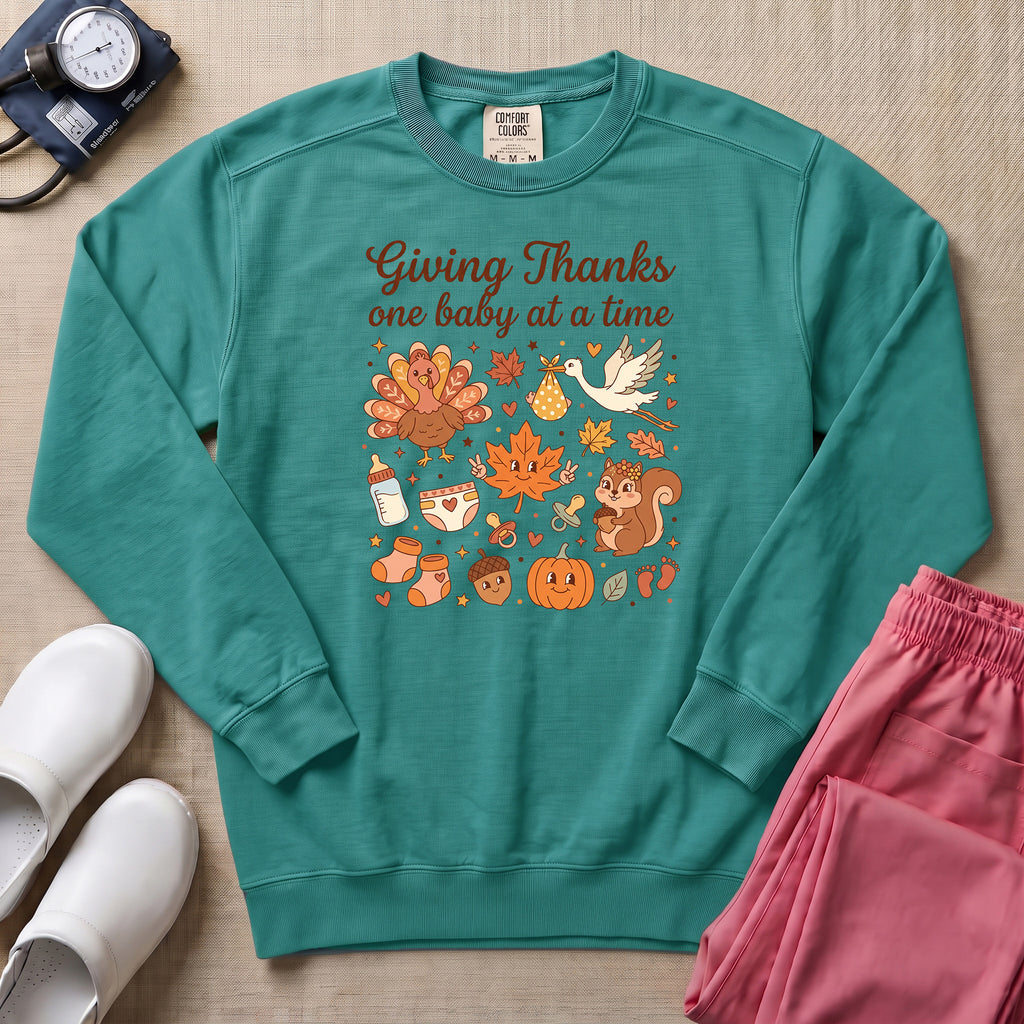 Retro Giving Thanks One Baby At A Time Thanksgiving L&D and NICU Nurse Sweatshirt - Seafoam Comfort Colors Sweatshirt | HugTee