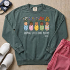 Helping Little Ones Bloom Floral NICU Nurse Sweatshirt - Blue Spruce Comfort Colors Sweatshirt | HugTee