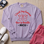 I Teach Tiny Humans How To Breathe NICU Sweatshirt - Orchid Comfort Colors Sweatshirt | HugTee
