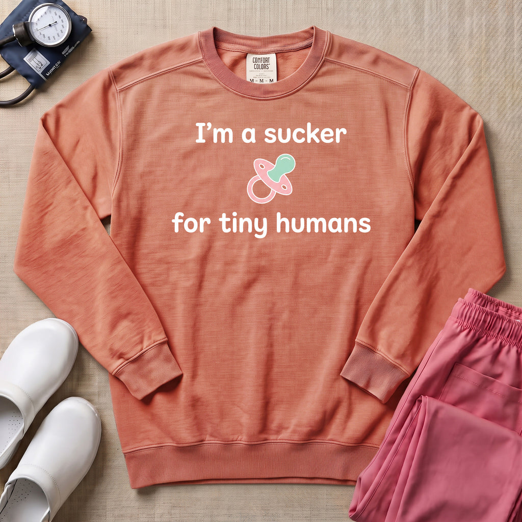 I'm A Sucker For Tiny Humans Funny Pediatric NICU Nurse Sweatshirt - Terracotta Comfort Colors Sweatshirt | HugTee