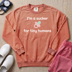 I'm A Sucker For Tiny Humans Funny Pediatric NICU Nurse Sweatshirt - Terracotta Comfort Colors Sweatshirt | HugTee