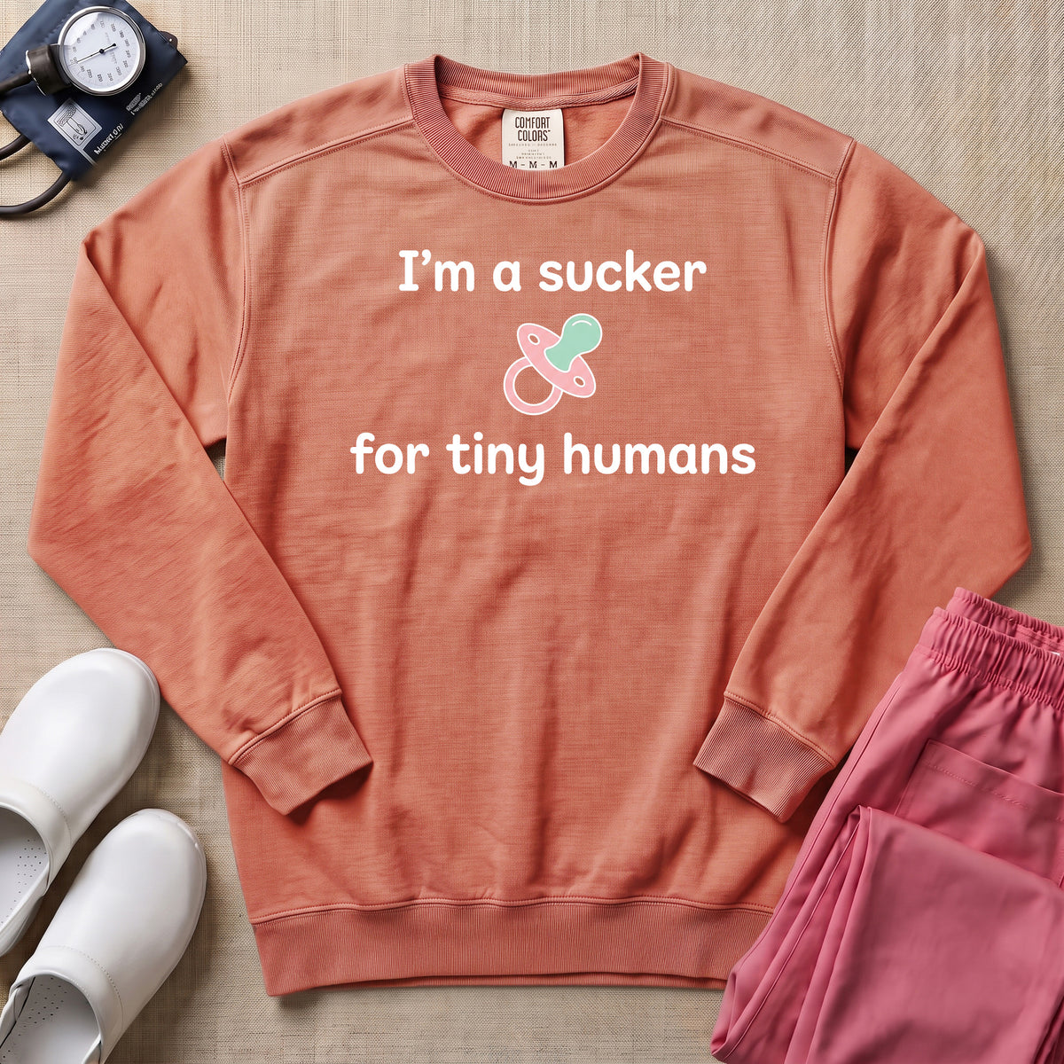 I'm A Sucker For Tiny Humans Funny Pediatric NICU Nurse Sweatshirt - Terracotta Comfort Colors Sweatshirt | HugTee