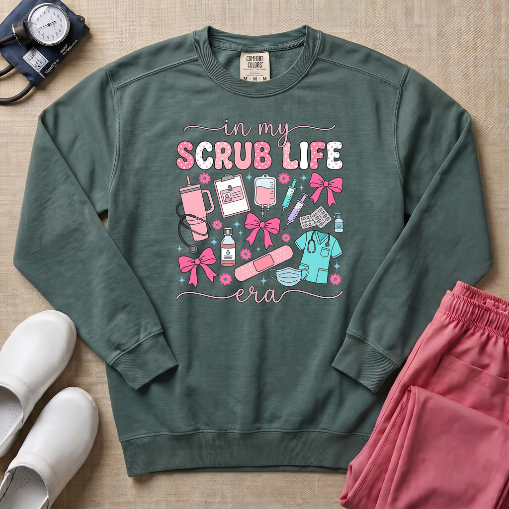 In My Scrub Life Era Coquette Nurse Sweatshirt - Blue Spruce Comfort Colors Sweatshirt | HugTee