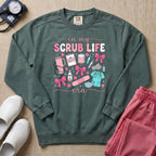 In My Scrub Life Era Coquette Nurse Sweatshirt - Blue Spruce Comfort Colors Sweatshirt | HugTee