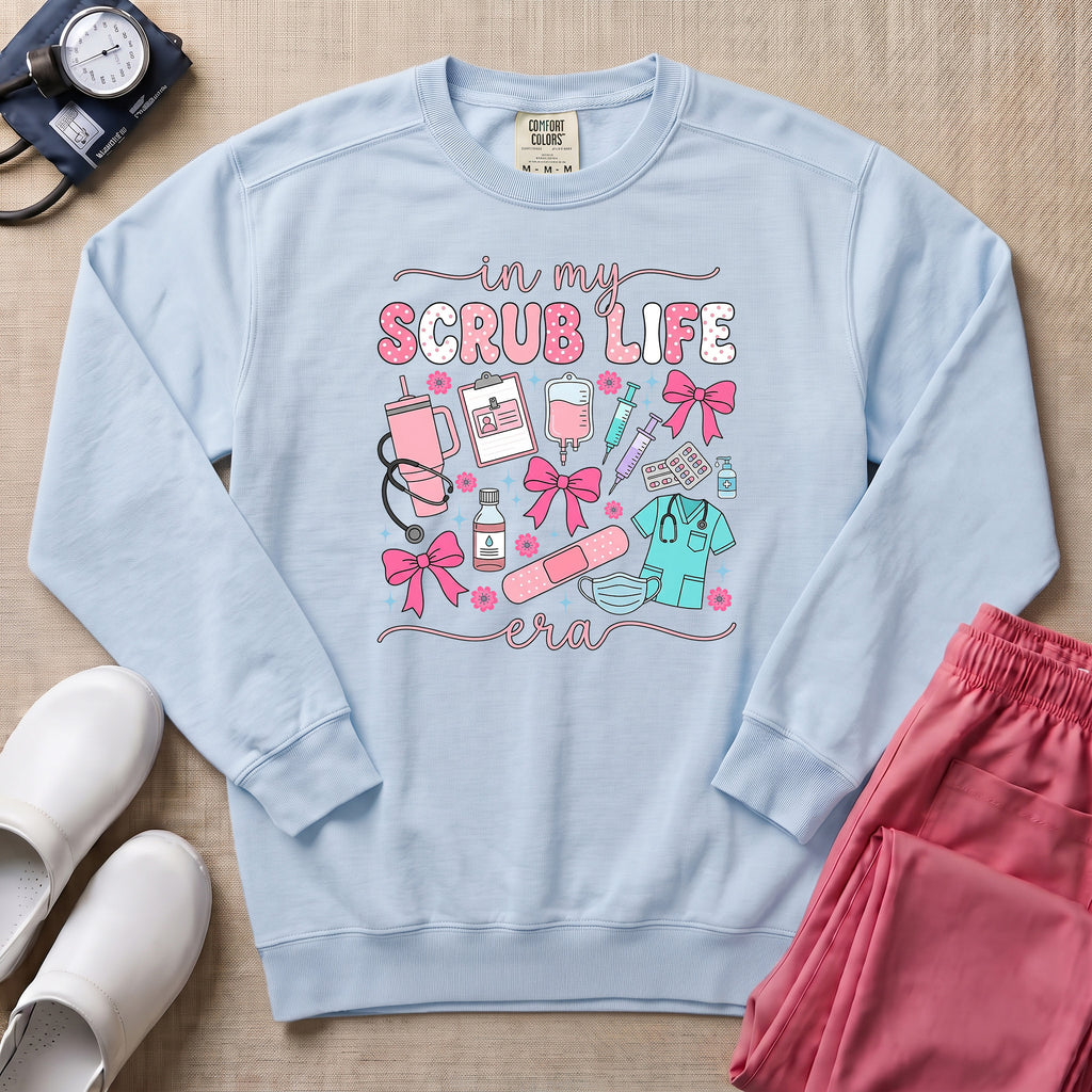 In My Scrub Life Era Coquette Nurse Sweatshirt - Chambray Comfort Colors Sweatshirt | HugTee