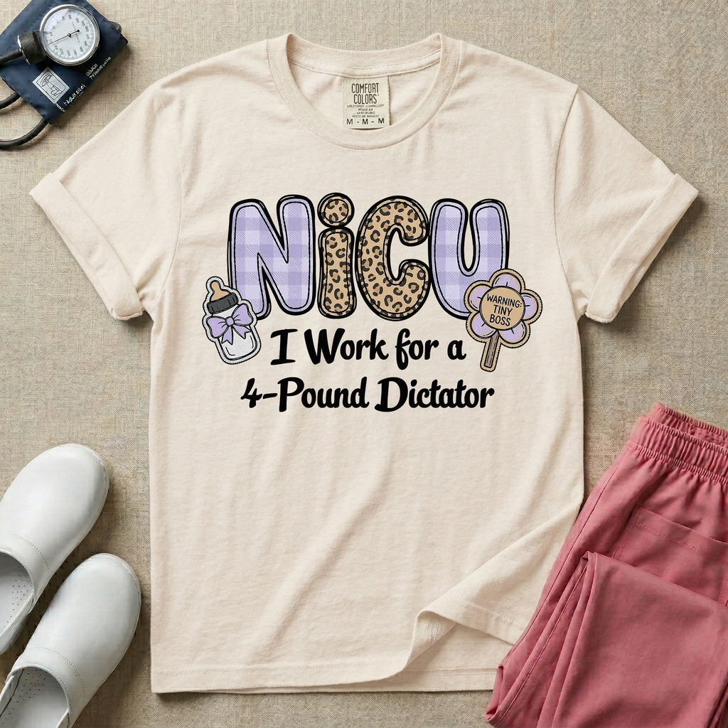 A funny t-shirt for NICU nurses featuring the text "NICU I Work for a 4-Pound Dictator" designed with purple plaid and leopard print letters, accompanied by graphics of a baby bottle with a bow and a rattle that says "WARNING: TINY BOSS".