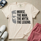 General nursing t-shirt featuring a minimalist white graphic of a bearded man wearing sunglasses and a nurse cap alongside the text "MURSE. THE MAN. THE MYTH. THE LEGEND."