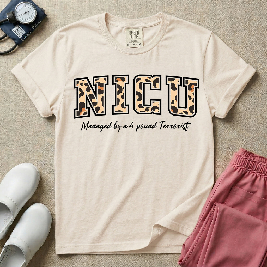 Neonatal Intensive Care Unit NICU nurse t-shirt with leopard print block letters and funny managed by a 4-pound terrorist graphic in ivory color.