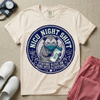 A humorous graphic for a Neonatal Intensive Care Unit featuring a circular design with an illustration of a tired raccoon wearing a medical face mask and holding a baby bottle labeled 'NICU', surrounded by the text 'NICU NIGHT SHIFT' at the top and 'STAYING ALIVE ON PURE SPITE & CAFFEINE' at the bottom.