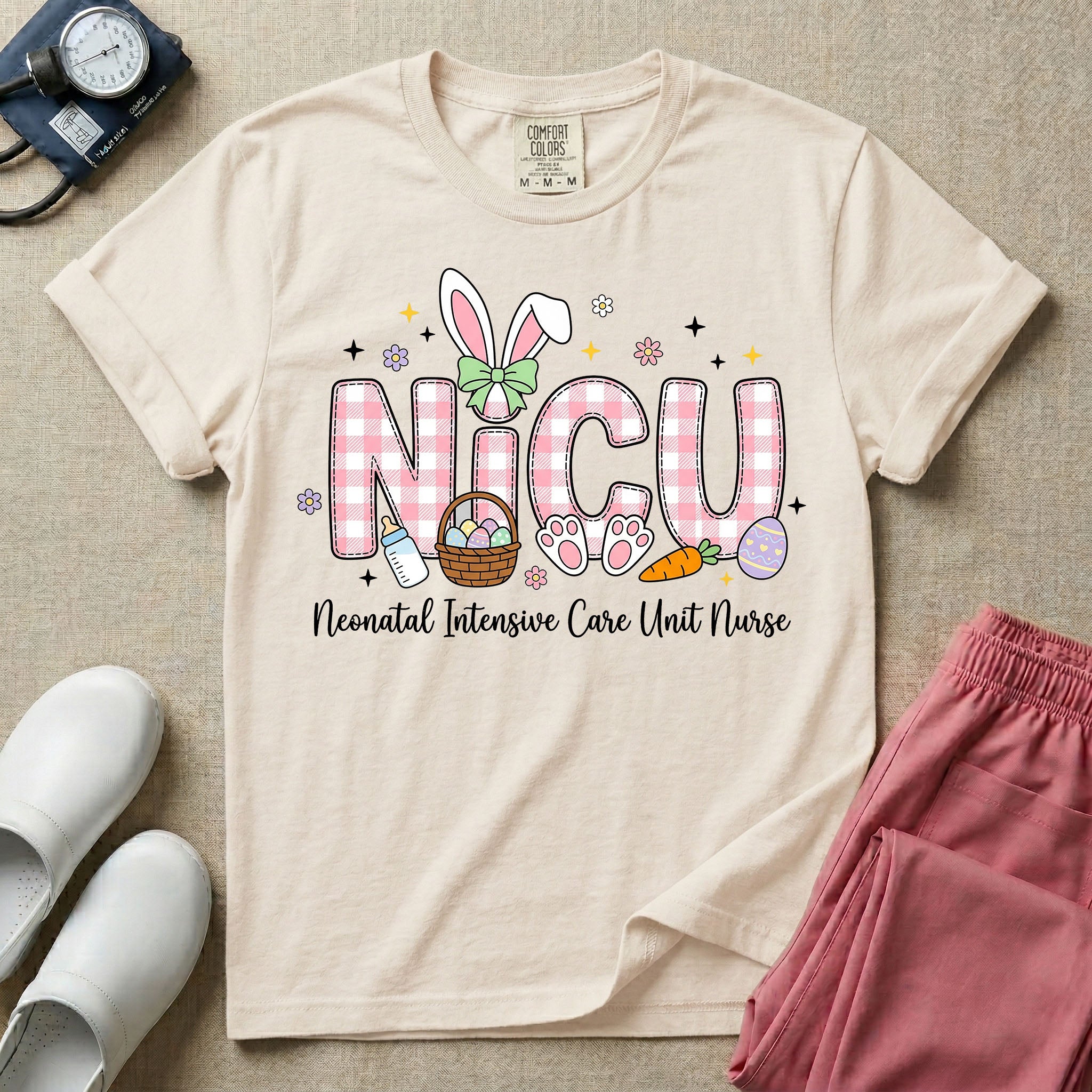 Neonatal Intensive Care Unit NICU nursing t-shirt featuring the letters NICU in a pink plaid pattern with bunny ears on the I, alongside a basket and Easter eggs, positioned above the cursive text "Neonatal Intensive Care Unit Nurse".
