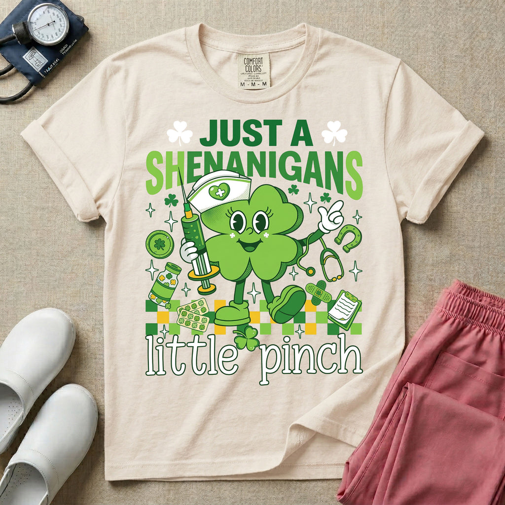 General nursing nurse t-shirt with a retro clover just a shenanigans little pinch graphic in ivory color.